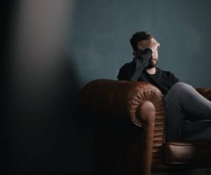 Emotional Distress, Man Sitting on Leather Couch