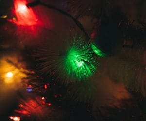Close up on the christmas tree green light decoration - - christmas, holiday concept