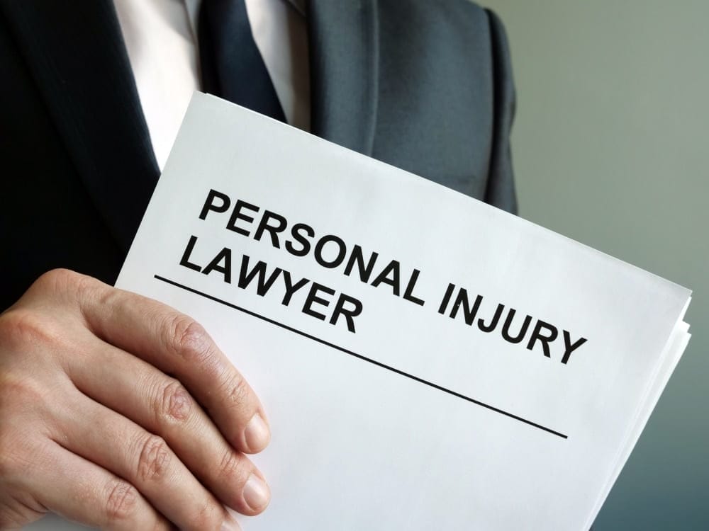 A person with a white paper on his hands. Nick parr is the best Personal,Injury Lawyer.