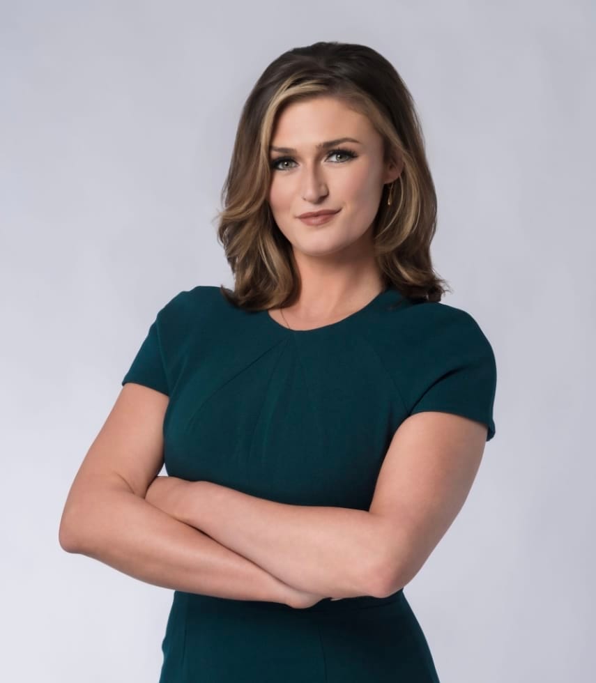 Person posing confidently with crossed arms